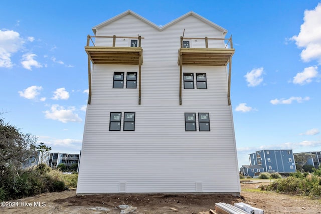 view of property exterior with a balcony