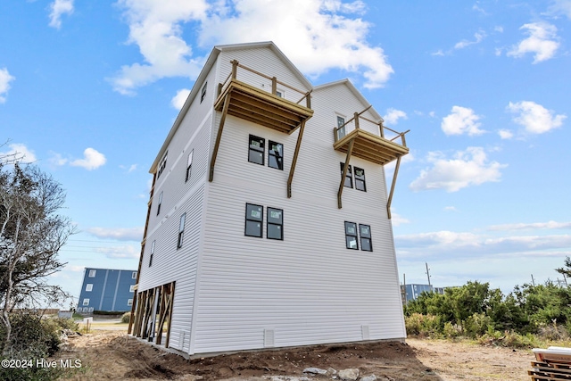 view of property exterior featuring a balcony