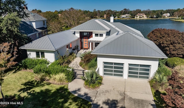 view of front of house with a water view