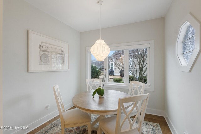 sunroom featuring a water view, ceiling fan, and wood ceiling