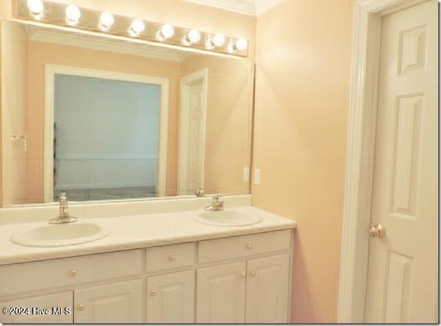 bathroom featuring vanity and crown molding