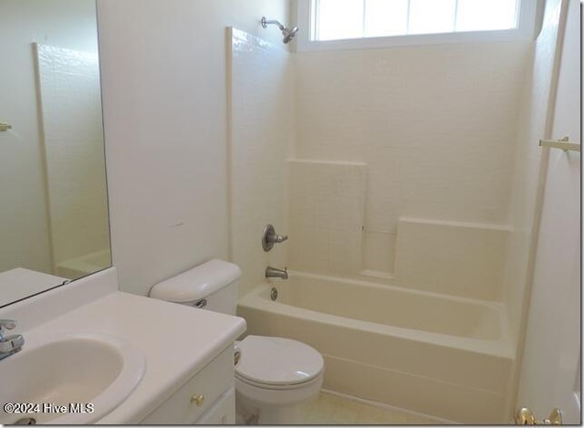 full bathroom with vanity, a healthy amount of sunlight, bathtub / shower combination, and toilet