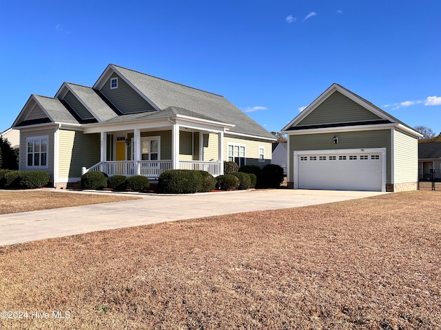 view of front of home featuring a porch and a garage