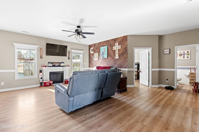 living room with ceiling fan, a healthy amount of sunlight, and light hardwood / wood-style floors