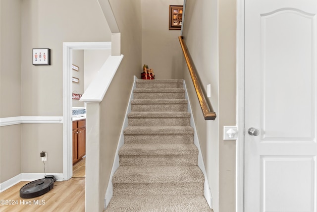 stairs with wood-type flooring