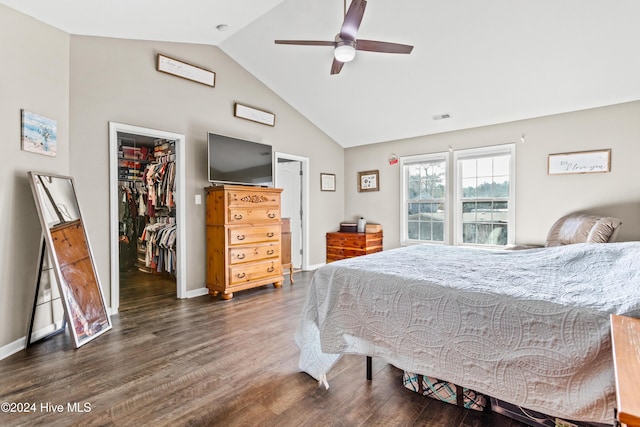 bedroom featuring high vaulted ceiling, dark hardwood / wood-style floors, ceiling fan, a spacious closet, and a closet