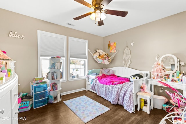 bedroom featuring ceiling fan and dark wood-type flooring