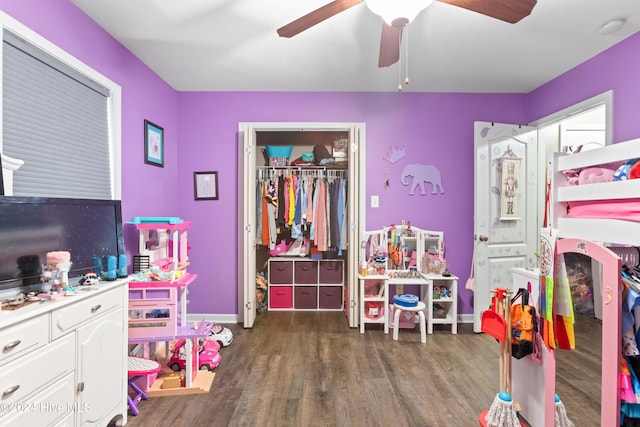 bedroom featuring dark hardwood / wood-style flooring and ceiling fan