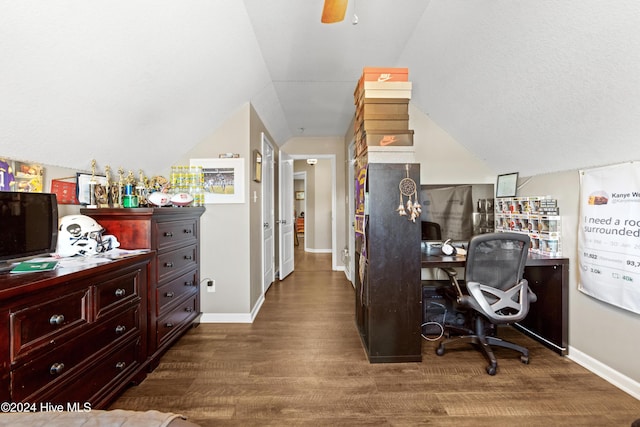 home office featuring hardwood / wood-style flooring, ceiling fan, and vaulted ceiling