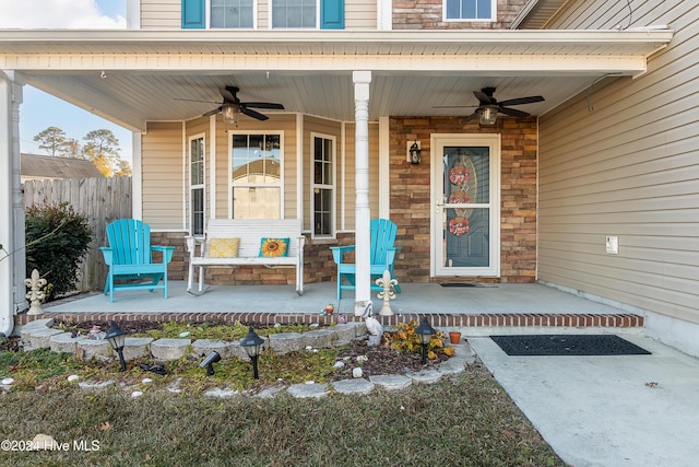 property entrance with ceiling fan and a porch