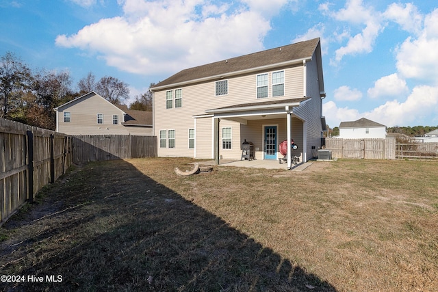 back of house with a yard, a patio, and cooling unit