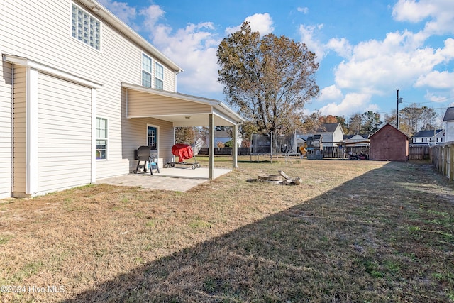 view of yard with a patio area and a trampoline