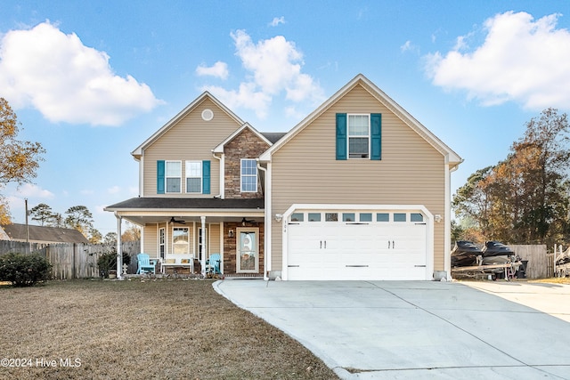 view of front property with covered porch and a garage