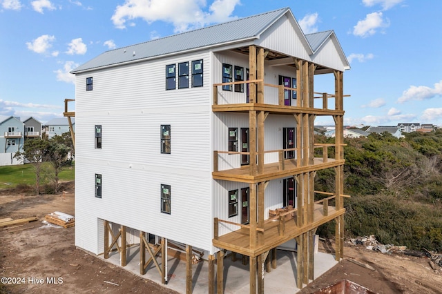 rear view of house featuring a balcony