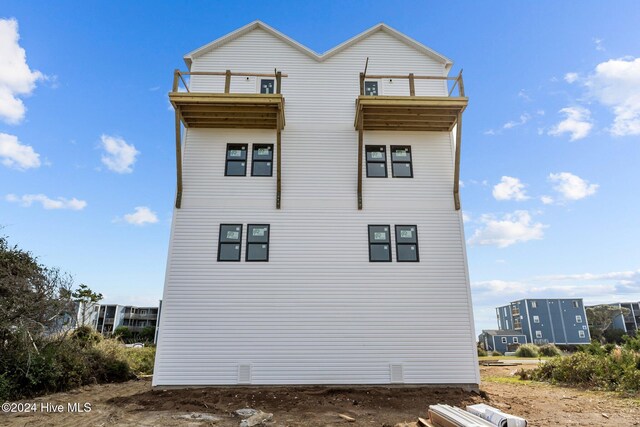 view of home's exterior featuring a balcony