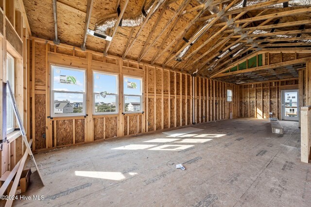 miscellaneous room with lofted ceiling