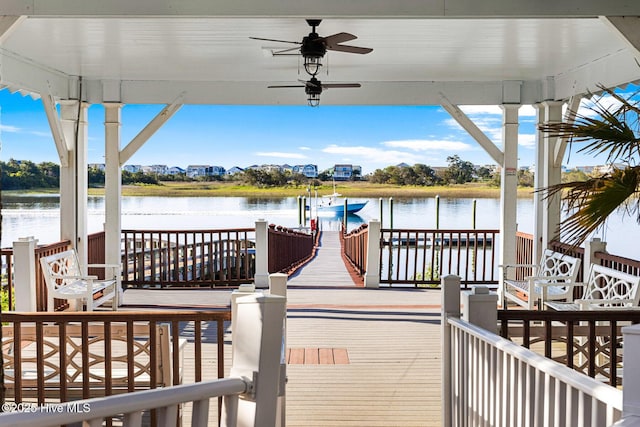 view of dock featuring boat lift and a water view