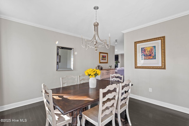 dining space featuring a chandelier, dark hardwood / wood-style flooring, and ornamental molding