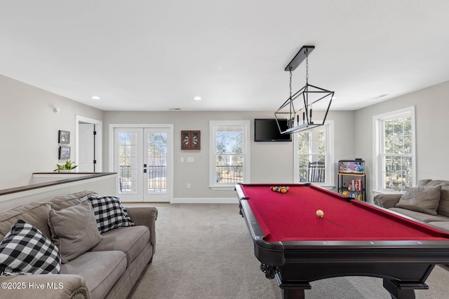 recreation room featuring carpet floors, pool table, french doors, and a healthy amount of sunlight