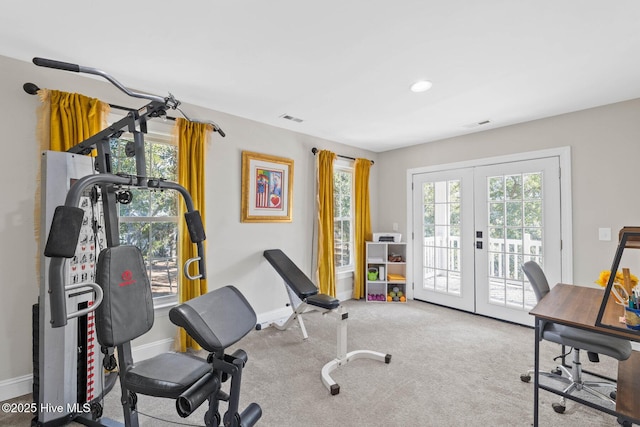 workout area featuring visible vents, carpet, baseboards, and french doors