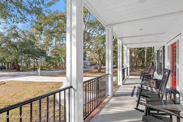 wooden terrace featuring covered porch