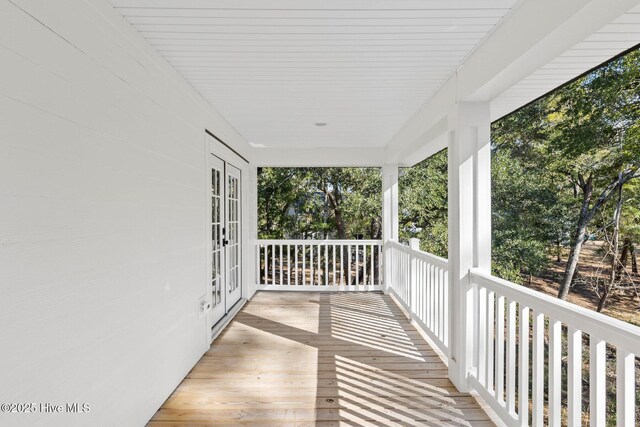 wooden deck featuring french doors