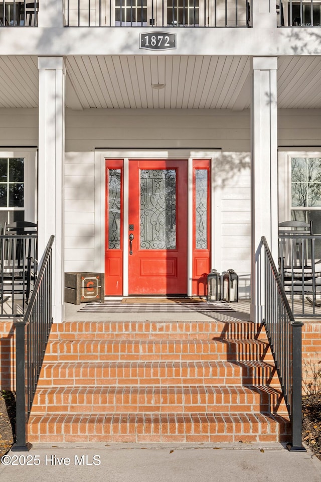 doorway to property with a porch