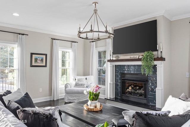 living room with dark wood-type flooring, crown molding, and a chandelier