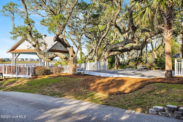 surrounding community featuring fence