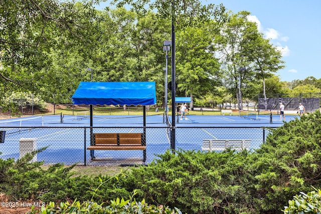 view of tennis court with fence
