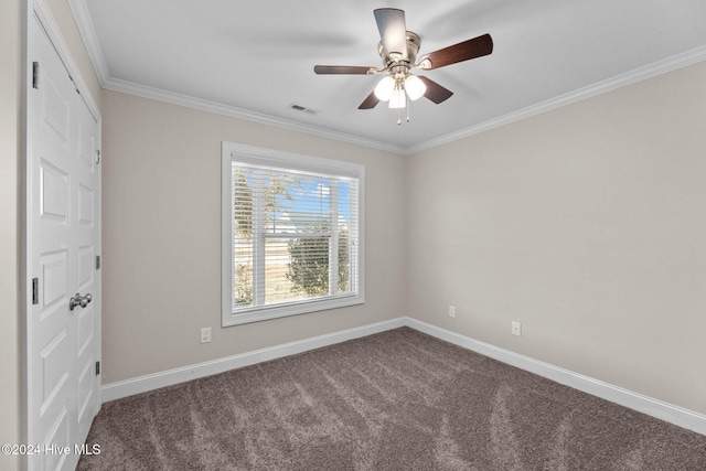 carpeted empty room featuring ceiling fan and ornamental molding