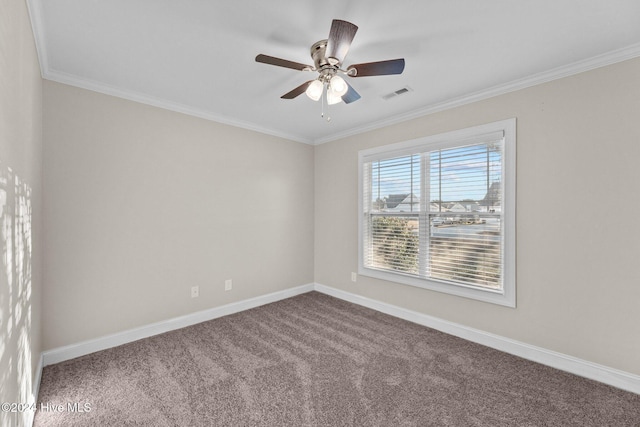 carpeted empty room featuring ceiling fan and crown molding