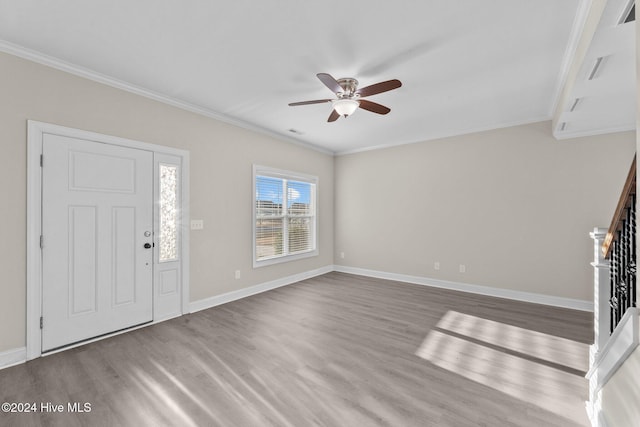 foyer with crown molding, ceiling fan, and light wood-type flooring