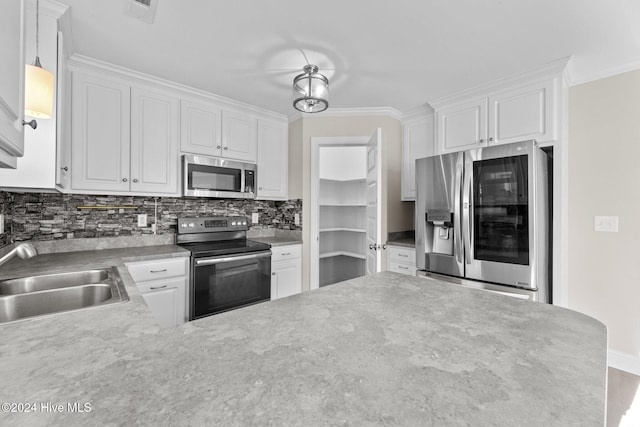 kitchen featuring white cabinetry and appliances with stainless steel finishes