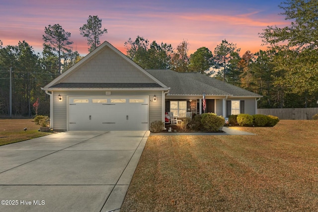 view of front of house with a lawn and a garage