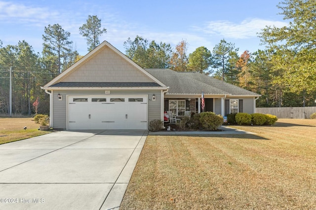 view of front of house with a garage and a front yard