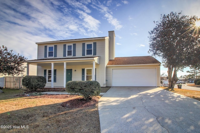 view of front facade with a garage and covered porch