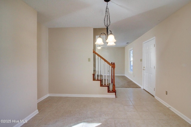 entryway featuring a notable chandelier