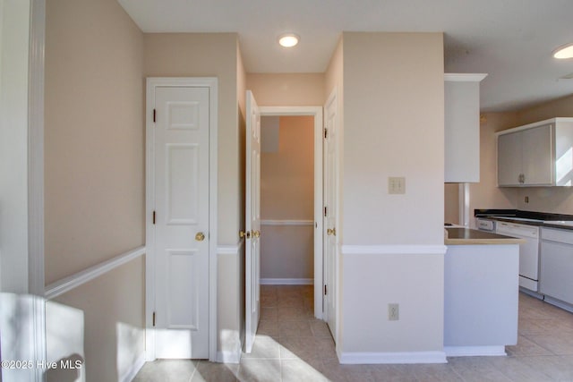 kitchen with dishwasher and light tile patterned flooring