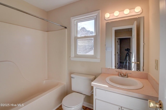 full bathroom with toilet, vanity, and washtub / shower combination