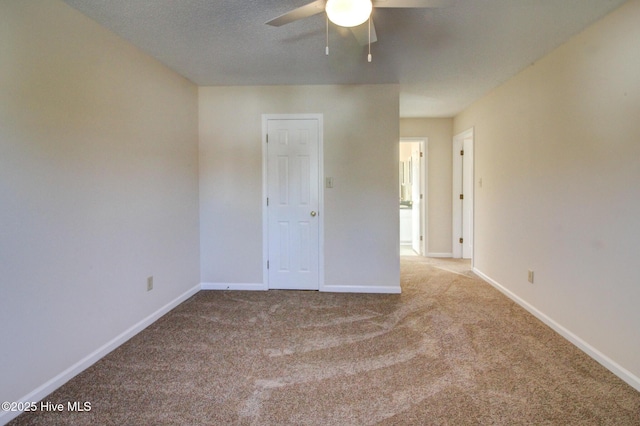 unfurnished room with light carpet and ceiling fan