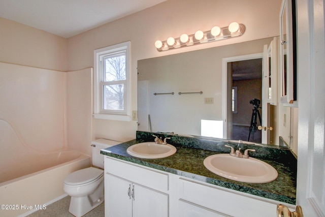 full bathroom with shower / bathing tub combination, toilet, and vanity