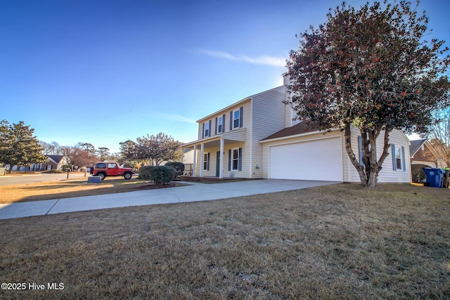 view of front of property featuring a garage and a front yard