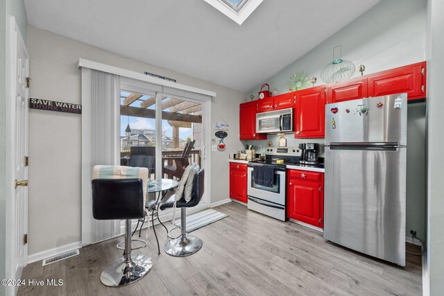 kitchen featuring appliances with stainless steel finishes and light wood-type flooring