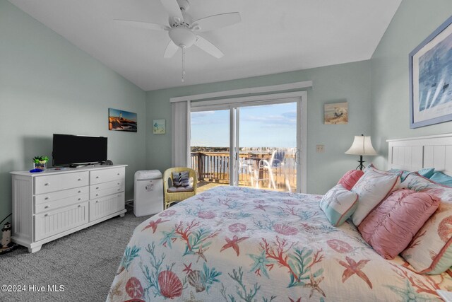 bedroom featuring dark colored carpet, connected bathroom, and ceiling fan