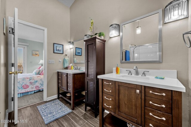 bathroom featuring a shower with door