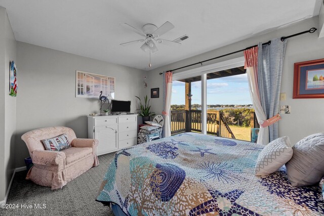 carpeted bedroom with ceiling fan and a closet