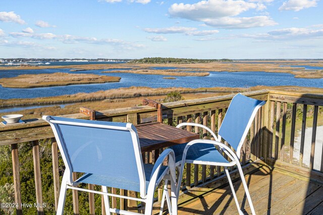 deck featuring a water view