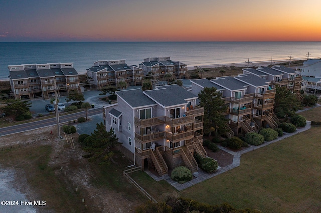 aerial view at dusk with a water view