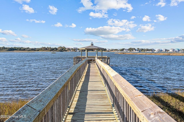 view of dock featuring a gazebo and a water view